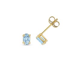 Blue Topaz Oval Claw Set Studs In 9ct Gold 