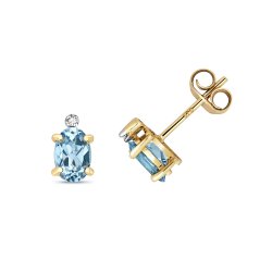 Diamond & Blue Topaz Oval Claw Set Studs In 9ct Gold 